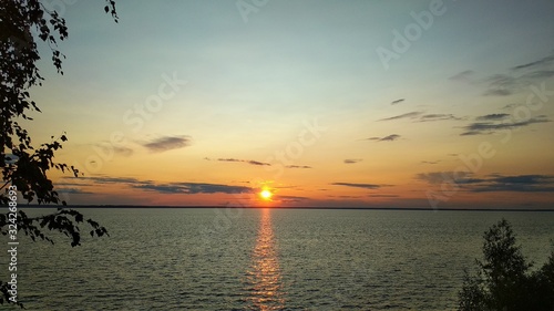 colorful sunset on the Volga river © Igor