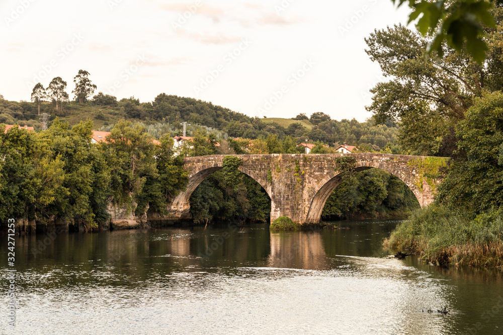 Oruna de Pielagos, Spain. The Puente Viejo (Old Bridge) over the river Pas in Cantabria