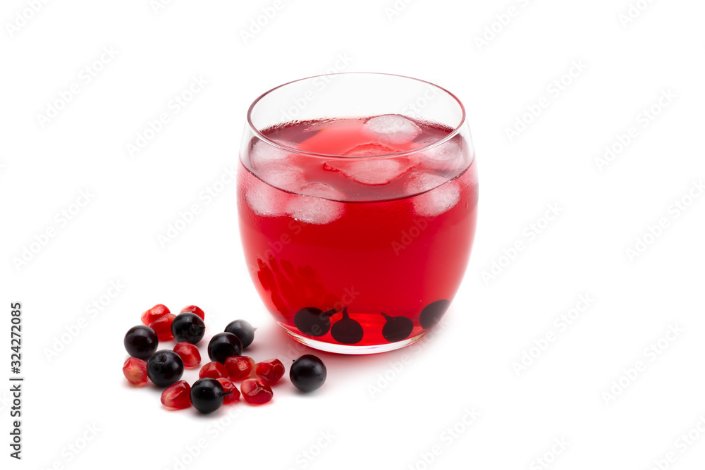 Compote pomegranate berries and blackcurrant in a glass on a white isolated background Compote pomegranate berries and blackcurrant in a glass on a white isolated background