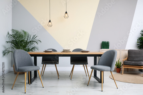 Fototapeta Modern wooden dining table in room interior