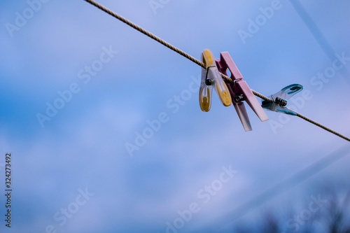 laundry hanging on clothesline.  shot upwards with blue sky in background and copy space