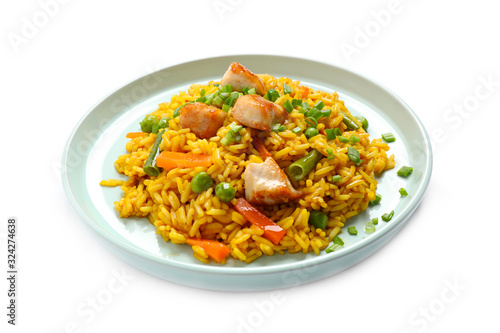 Delicious rice pilaf with chicken and vegetables isolated on white