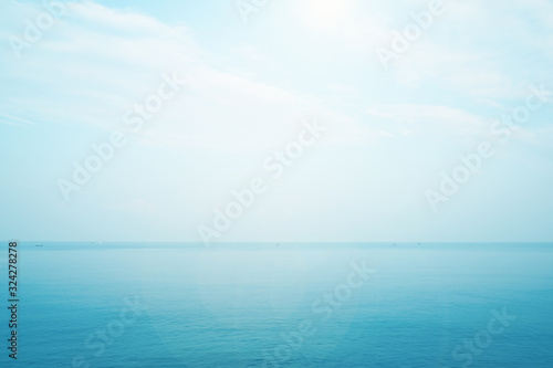 blurred seascape with sun light