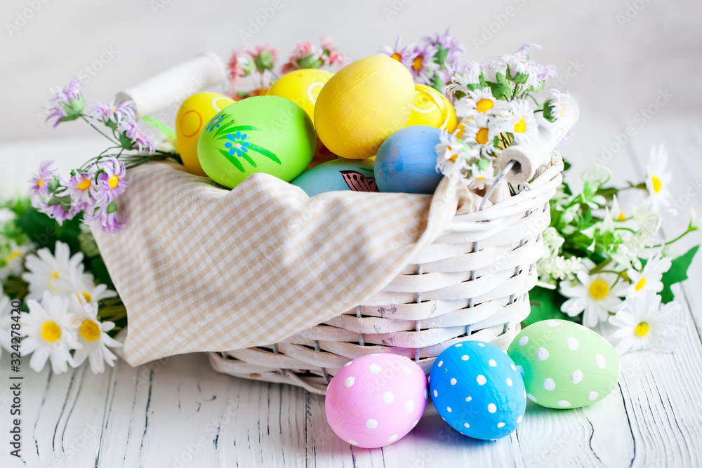Fototapeta premium Happy Easter. Congratulatory easter background. Easter eggs and flowers. Background with copy space. Selective focus.