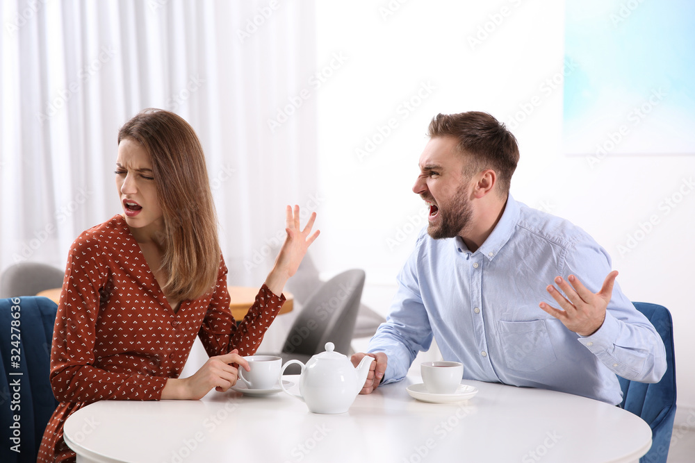 Couple having quarrel in cafe. Relationship problems Couple having quarrel in cafe. Relationship problems