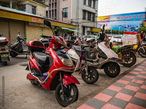Shantou/china-30 march 2018:Chinese electric motorcycle parked in downtown district at shantou city at china.electric motorcycle is the most famous automobile in china