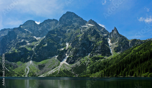 The lake Morskie Oko or Eye of the Sea. Western Carpathian mountains. The Tatra National Park in the Rybi Potok (the Fish Brook) Valley, Zakopane, Poland. photo