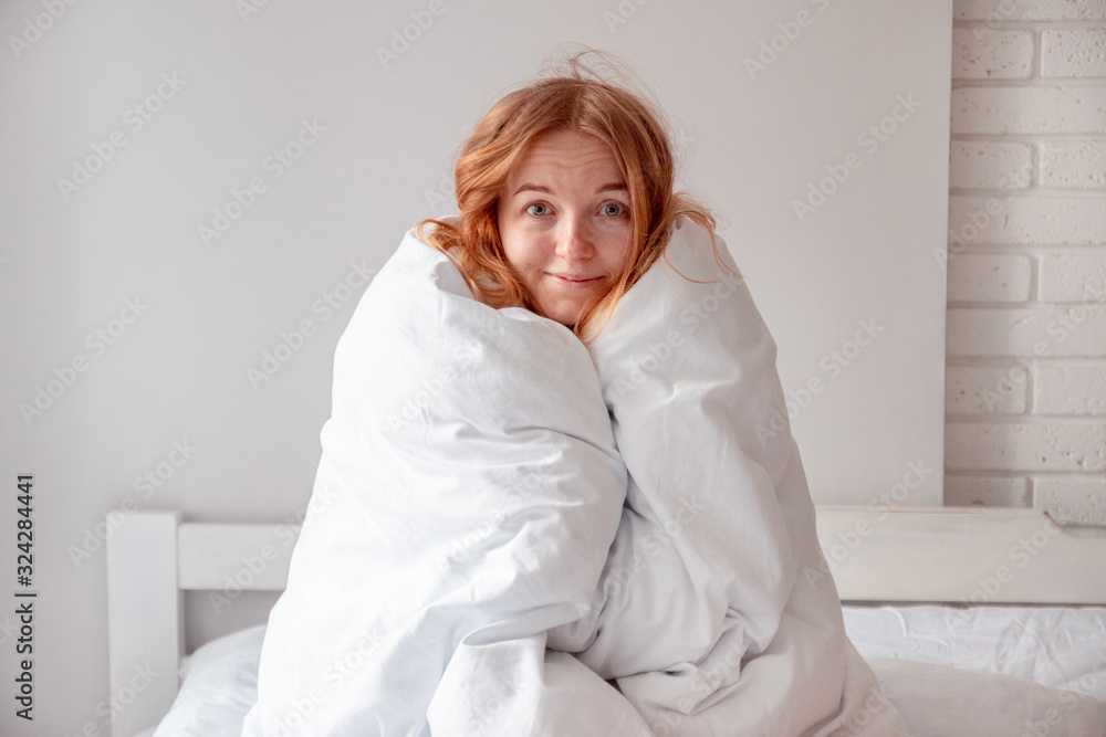 The girl wrapped herself in a blanket The girl wrapped herself in a blanket