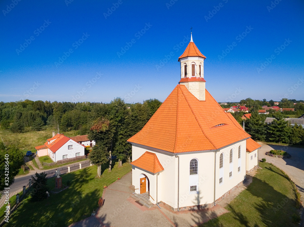 Aerial view of beautiful Saint Stanislaus Kostka Church in Pozezdrze, Poland (former Possessern, East Prussia) Aerial view of beautiful Saint Stanislaus Kostka Church in Pozezdrze, Poland (former Possessern, East Prussia)