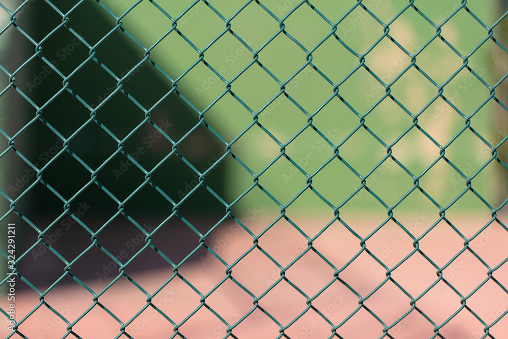 A fence in a sports facility A fence in a sports facility