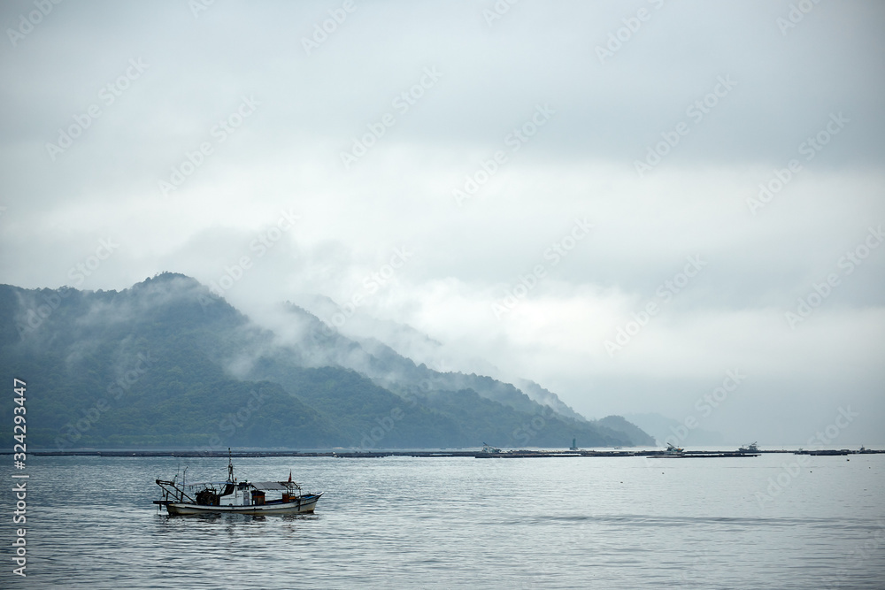 Fishing boat in the fog