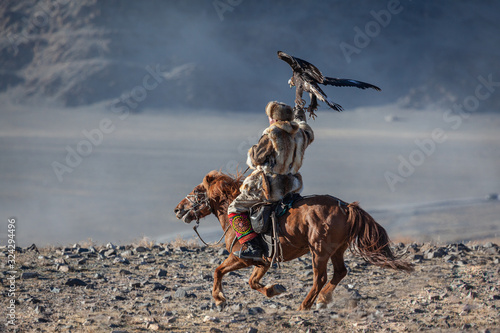 Kazakh berkut hunting western Mongolia Golden eagle festival horse riding