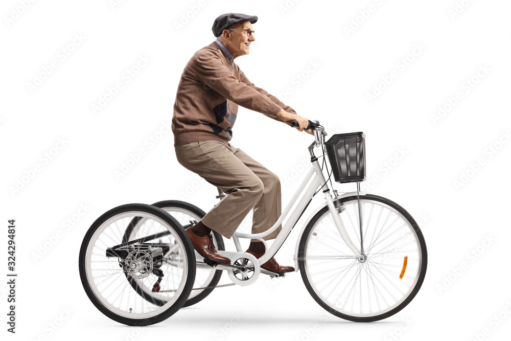 Senior man riding a tricycle Senior man riding a tricycle