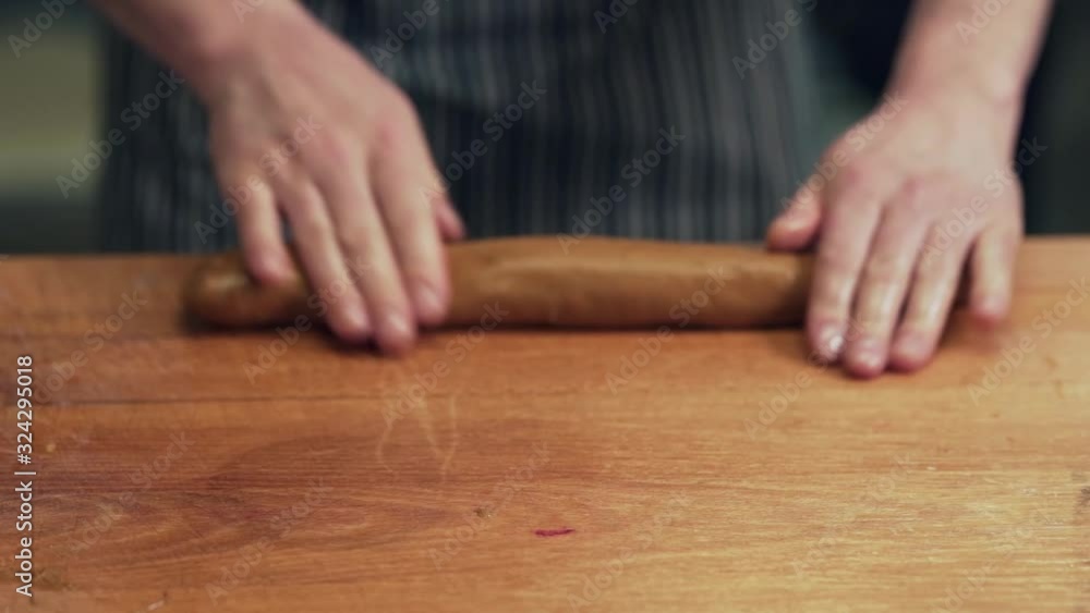 baker kneads dough on baguettes baker kneads dough on baguettes