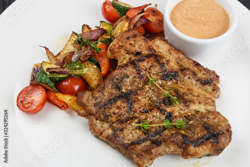 Grilled pork steak with sau...