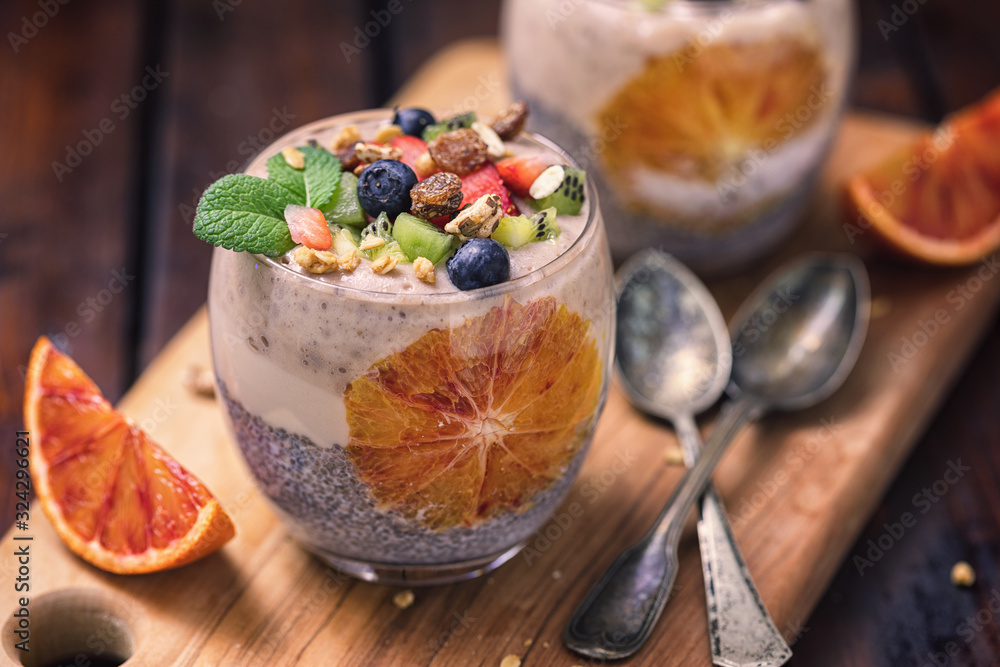 Chia seed pudding with fresh bananas,granola and bloody oranges Chia seed pudding with fresh bananas,granola and bloody oranges