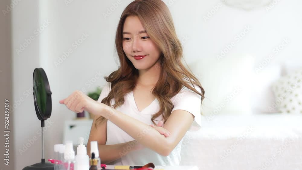 Portrait of young asian woman review giveaway gift product fan following channel, recording video make up lipstic cosmetic at home. Beauty blogger present beauty cosmetics Portrait of young asian woman review giveaway gift product fan following channel, recording video make up lipstic cosmetic at home. Beauty blogger present beauty cosmetics