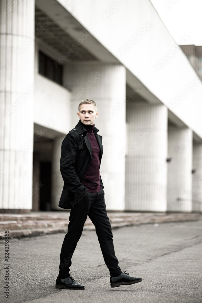 Stylish man in black trenchcoat Stylish man in black trenchcoat