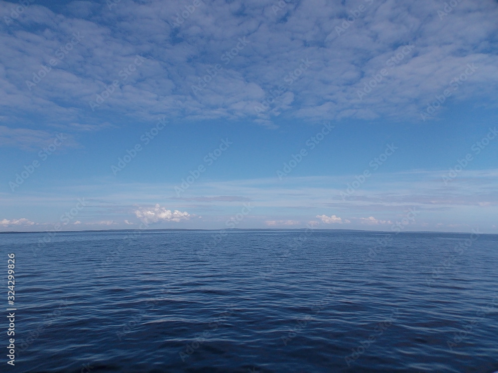 Serenity: clouds and Onega lake in Russia Serenity: clouds and Onega lake in Russia