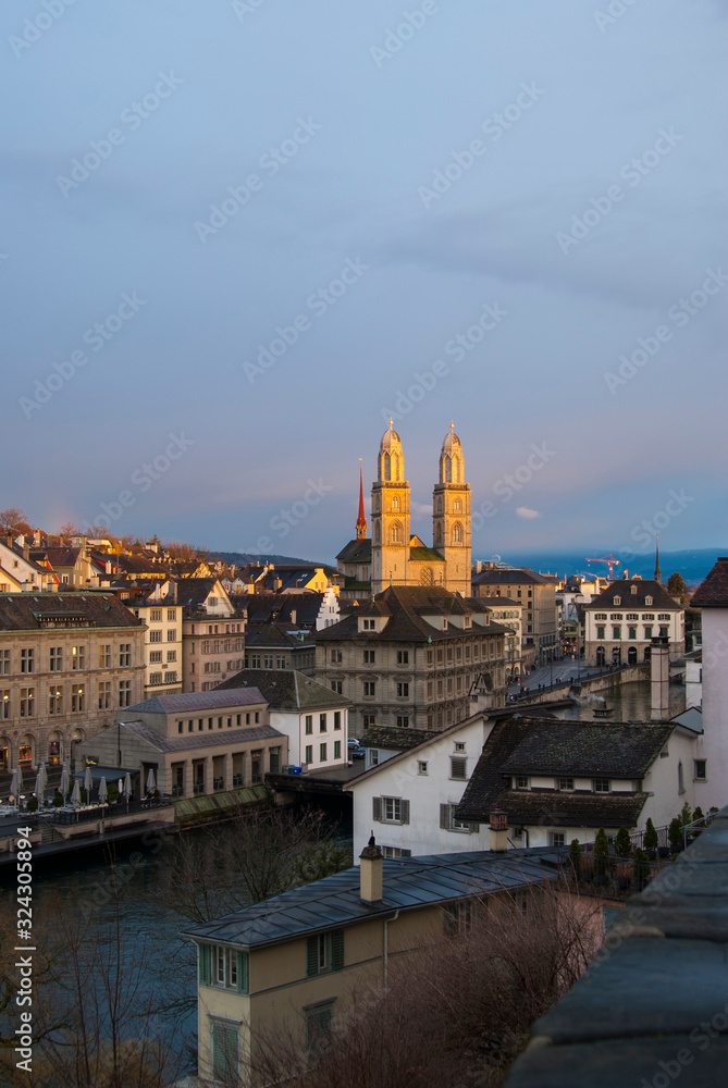 Sunset light falls on the cathedral. Zurich, Switzerland. City view after rain.