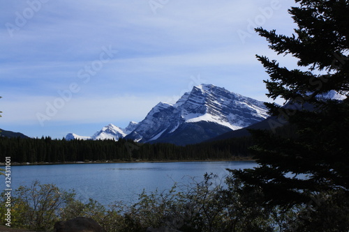 Lake in the Rocky Mountains with some flowers postcard potential