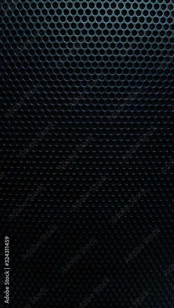 Abstract background metal mesh with even spaced holes in black. Abstract background metal mesh with even spaced holes in black.