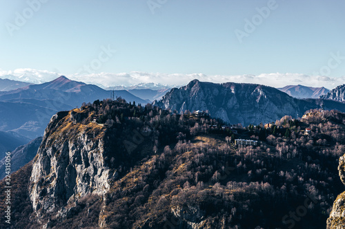 Nature and landscape during the late afternoon seen from the Lombard Mountains above the city of Lecco, Italy - February 2019.