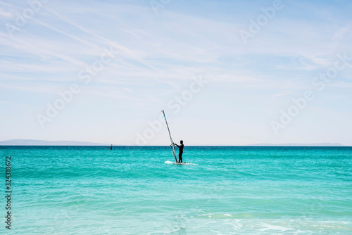 windsurfing in a tropical beach
