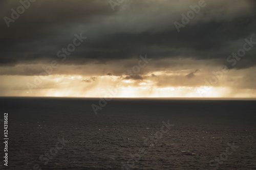 Scotland, Caithness, view of Pentland Firth from Dunnet Head, Storm clouds over sea at sunset photo