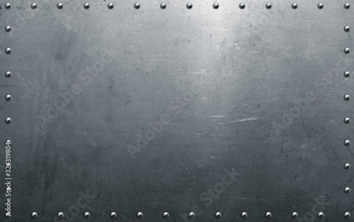Metal background with rivets, polished steel texture photo
