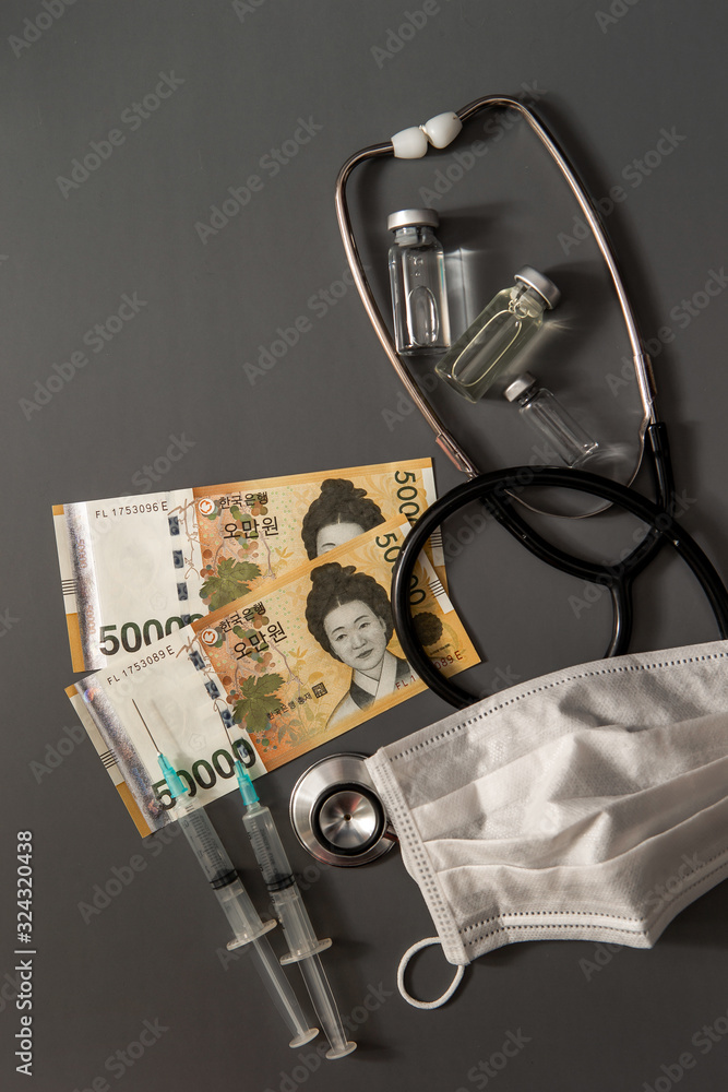 Korean currency with medical tools 