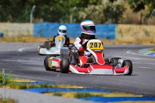 Young go cart racer on circuit © Mark_studio