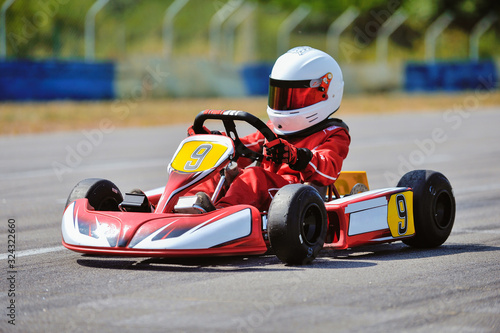 Fotografia Young go cart racer on circuit