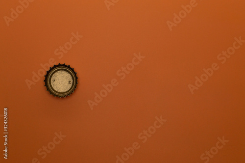 template of bottle cap on orange background back