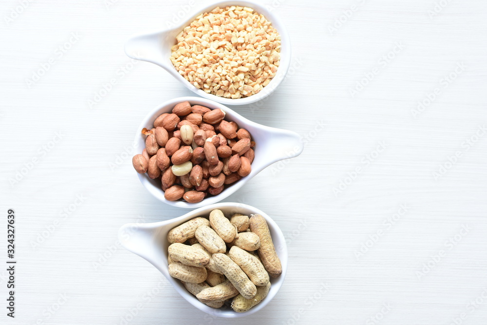 Dried peanuts (Arachis hypogaea) peanuts in shells, whole and chopped in containers Dried peanuts (Arachis hypogaea) peanuts in shells, whole and chopped in containers