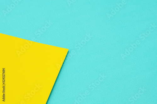 detail of a blue and yellow color paper texture. - background.