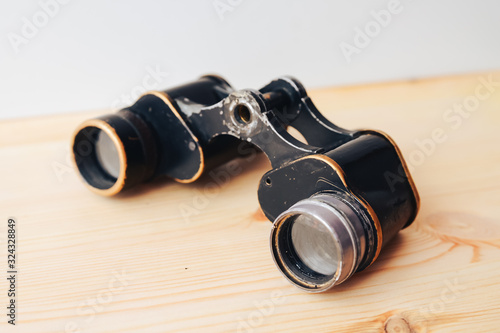 old black binoculars on white background