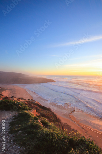 Amazing sunset in a beach with the ocean in background. 