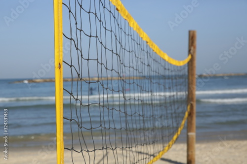 volleyball net on the sandy beach of the sea 