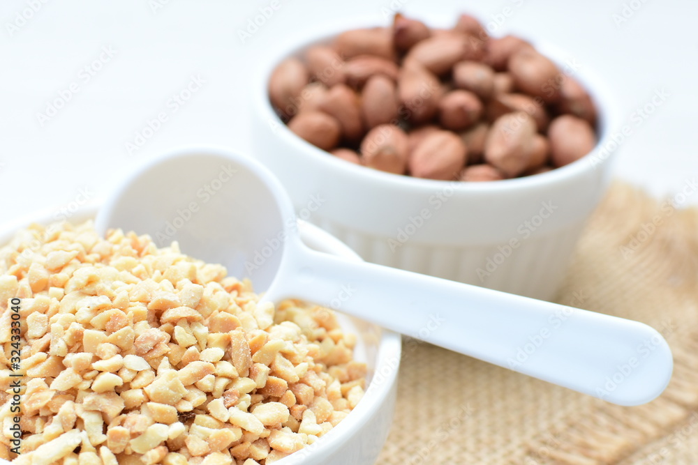 (Arachis hypogaea) dried whole peanuts without husk and chopped in containers (Arachis hypogaea) dried whole peanuts without husk and chopped in containers
