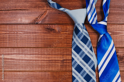 accessories for men. colorful ties on a wooden background. concept of happy father's day or shoppig