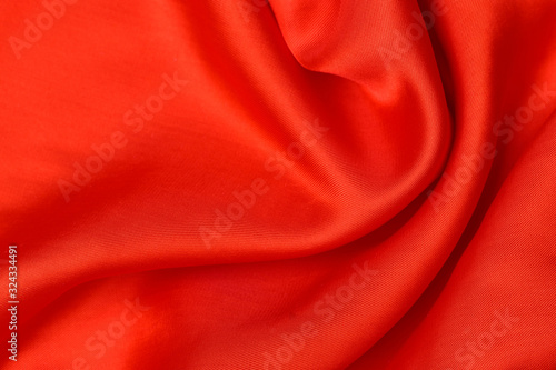 expensive fabric texture. abstract background with soft waves. Smooth elegant red silk or satin luxury cloth