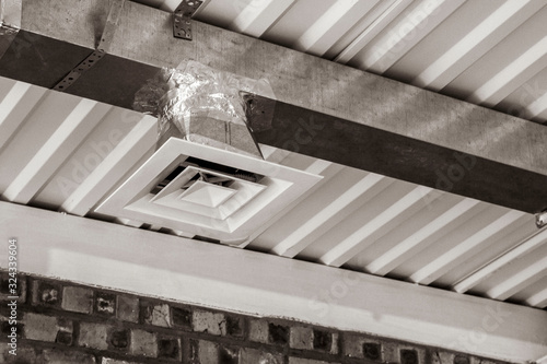 exhaust diffuser and duct in a close-up ventilation system. front and back background blurred bokeh