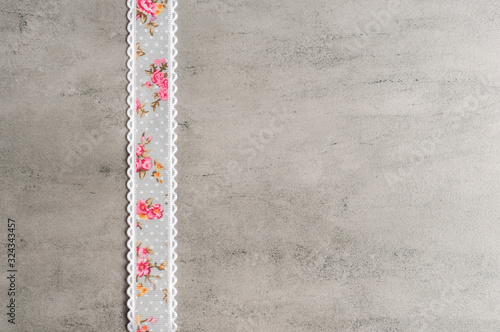 Ribbon on a grey background.Copy space.Flower ribbon.Handmade