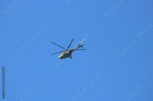 military helicopter in the sky