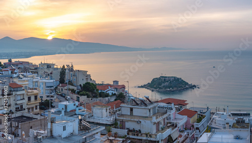 Sunrise over Piraeus, the city port near Athens in Greece with Koumoundourou island in the distance