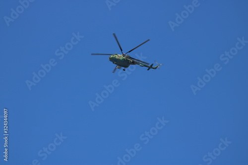 military helicopter in the sky