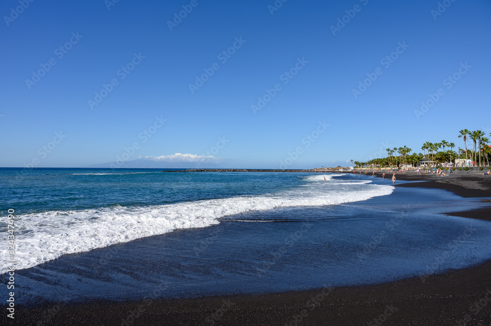 All year sun vacation destination, blue ocean water on  beach Playa del Duque in Costa Adeje, Tenerife island, Canary, Spain