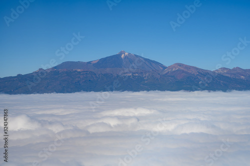 Aerial overcloud view on Tenerife island from airplane © barmalini