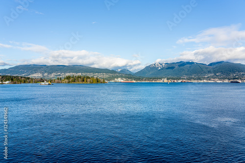 Vancouver, British Columbia, Canada - December, 2019 - Mountain View with clouds in a Beautiful blue sky day.